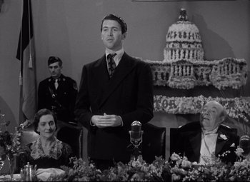 Movie still from “Mr. Smith Goes to Washington” (1939), directed by Frank Capra – A black and white photo of a man standing in front of a crowd; Medium shot, Low angle