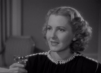 Movie still from “Mr. Smith Goes to Washington” (1939), directed by Frank Capra – An older woman holding a glass in her hand; Close Up shot, High angle