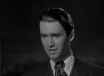 Movie still from “Mr. Smith Goes to Washington” (1939), directed by Frank Capra – Black and white photograph of a man wearing a suit and tie; Close Up shot, Low angle