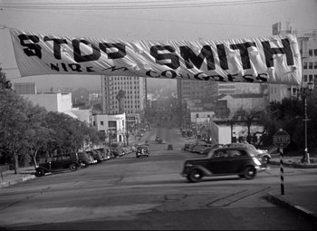 Movie still from “Mr. Smith Goes to Washington” (1939), directed by Frank Capra – A black and white photo of cars driving down a street; Extreme Wide shot, High angle