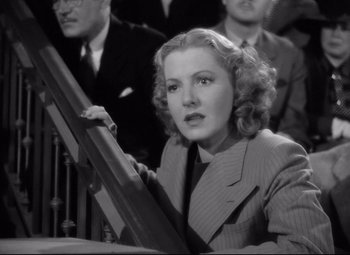 Movie still from “Mr. Smith Goes to Washington” (1939), directed by Frank Capra – An old photo of a woman in a business suit; Close Up shot, High angle