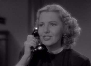 Movie still from “Mr. Smith Goes to Washington” (1939), directed by Frank Capra – A woman holding a phone up to her ear; Close Up shot, Low angle