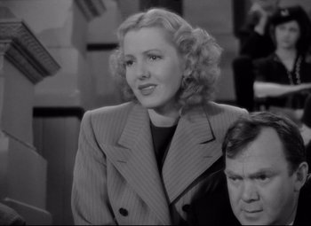 Movie still from “Mr. Smith Goes to Washington” (1939), directed by Frank Capra – An old photo of a woman and a man in a suit; Close Up shot, Low angle