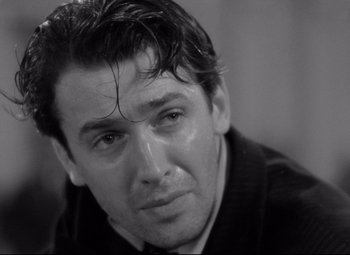 Movie still from “Mr. Smith Goes to Washington” (1939), directed by Frank Capra – Black and white photograph of a man with wet hair; Close Up shot, Over the shoulder angle