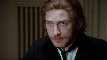 Movie still from “Mrs. Brown” (1997), directed by John Madden – A person wearing a suit and tie; Close Up shot, High angle