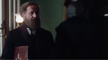 Movie still from “Mrs. Brown” (1997), directed by John Madden – A man in a suit and tie talking to another man in a suit and tie; Medium shot, Over the shoulder angle