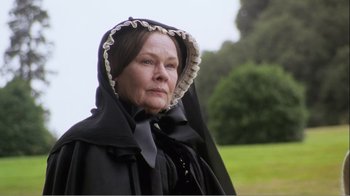 Movie still from “Mrs. Brown” (1997), directed by John Madden – An older woman wearing a black dress and a black hat; Close Up shot, Low angle