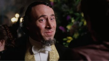 Movie still from “Mrs. Brown” (1997), directed by John Madden – A wax figure of a man in a suit and bow tie; Close Up shot, Over the shoulder angle