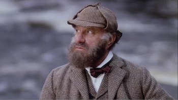 Movie still from “Mrs. Brown” (1997), directed by John Madden – A man with a beard wearing a suit and a hat; Close Up shot, Low angle