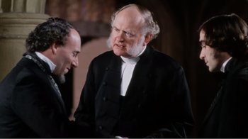 Movie still from “Mrs. Brown” (1997), directed by John Madden – A man in a suit and tie talking to another man in a suit and tie; Medium shot, Over the shoulder angle