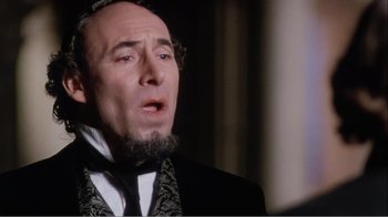 Movie still from “Mrs. Brown” (1997), directed by John Madden – An old man with a beard and a mustache wearing a black suit and a black tie; Close Up shot, Low angle