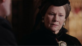 Movie still from “Mrs. Brown” (1997), directed by John Madden – An older woman wearing a black dress and a black hat; Close Up shot, Over the shoulder angle