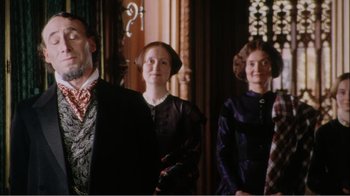 Movie still from “Mrs. Brown” (1997), directed by John Madden – A group of people standing next to each other in a room; Medium shot, Low angle