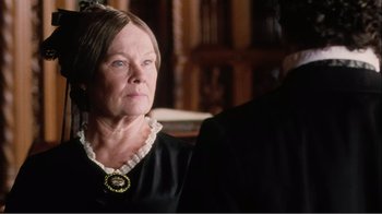 Movie still from “Mrs. Brown” (1997), directed by John Madden – An older woman in a black dress looking at the camera; Close Up shot, Over the shoulder angle