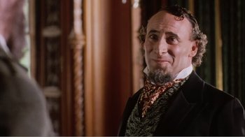 Movie still from “Mrs. Brown” (1997), directed by John Madden – A person wearing a suit and tie; Close Up shot, Over the shoulder angle