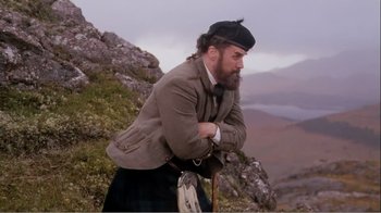 Movie still from “Mrs. Brown” (1997), directed by John Madden – A man with a beard wearing a jacket and a hat; Medium shot, Low angle