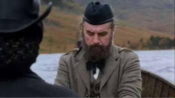 Movie still from “Mrs. Brown” (1997), directed by John Madden – A man with a long beard wearing a hat; Medium shot, Over the shoulder angle