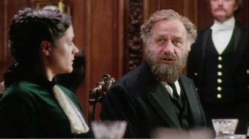 Movie still from “Mrs. Brown” (1997), directed by John Madden – An older man sitting next to an older woman in a chair; Close Up shot, Over the shoulder angle