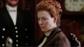 Movie still from “Mrs. Brown” (1997), directed by John Madden – A woman with red curly hair wearing a brown jacket; Close Up shot, High angle