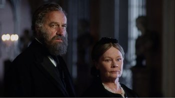 Movie still from “Mrs. Brown” (1997), directed by John Madden – A man and a woman standing next to each other; Medium shot, Low angle