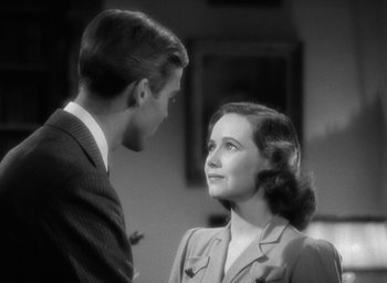 Movie still from “Mrs. Miniver” (1942), directed by William Wyler – A man and a woman looking at one another; Close Up shot, High angle
