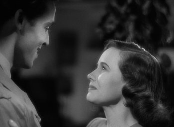 Movie still from “Mrs. Miniver” (1942), directed by William Wyler – A man and a woman looking at one another; Close Up shot, Low angle