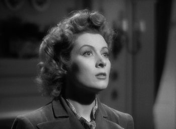 Movie still from “Mrs. Miniver” (1942), directed by William Wyler – An old photo of a woman looking up at the sky; Close Up shot, Low angle