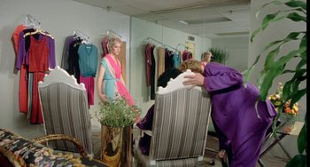 Movie still from “Ms .45” (1981), directed by Abel Ferrara – A woman in a purple dress hugging another woman in a purple dress; Wide shot, Over the shoulder angle