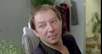 Movie still from “Ms .45” (1981), directed by Abel Ferrara – A person sitting in a chair; Close Up shot, Over the shoulder angle