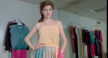 Movie still from “Ms .45” (1981), directed by Abel Ferrara – A woman standing in front of a mirror in a room; Medium shot, Low angle