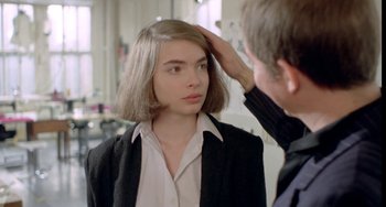 Movie still from “Ms .45” (1981), directed by Abel Ferrara – A woman is getting her hair combed by a man; Close Up shot, Over the shoulder angle