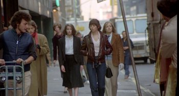 Movie still from “Ms .45” (1981), directed by Abel Ferrara – A group of people walking down a street; Wide shot, Low angle