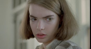 Movie still from “Ms .45” (1981), directed by Abel Ferrara – A person with short brown hair; Close Up shot, Over the shoulder angle