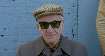 Movie still from “Ms .45” (1981), directed by Abel Ferrara – An older man wearing a hat and sunglasses; Close Up shot, Low angle