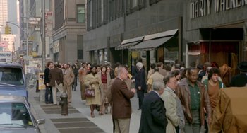 Movie still from “Ms .45” (1981), directed by Abel Ferrara – A crowd of people walking down a sidewalk; Extreme Wide shot, High angle