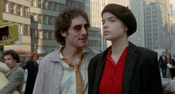 Movie still from “Ms .45” (1981), directed by Abel Ferrara – A man standing next to a woman wearing a hat; Close Up shot, Low angle