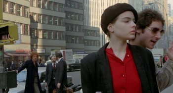 Movie still from “Ms .45” (1981), directed by Abel Ferrara – A woman in a red shirt and a black suit jacket; Close Up shot, Over the shoulder angle