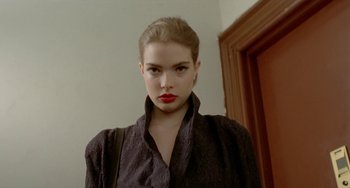 Movie still from “Ms .45” (1981), directed by Abel Ferrara – A woman with red lipstick is posing for a picture; Close Up shot, Low angle