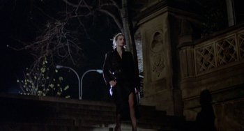 Movie still from “Ms .45” (1981), directed by Abel Ferrara – A woman is walking down the stairs at night; Wide shot, Low angle