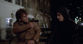 Movie still from “Ms .45” (1981), directed by Abel Ferrara – A man holding a gun pointed at a woman; Medium shot, Over the shoulder angle