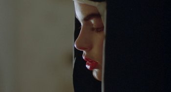 Movie still from “Ms .45” (1981), directed by Abel Ferrara – A person wearing a nun's outfit; Extreme Close Up shot, Low angle