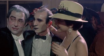 Movie still from “Ms .45” (1981), directed by Abel Ferrara – A man and a woman dressed in costume; Close Up shot, Over the shoulder angle