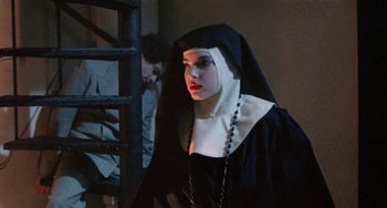 Movie still from “Ms .45” (1981), directed by Abel Ferrara – A woman dressed as a nun in front of a ladder; Medium shot, Low angle