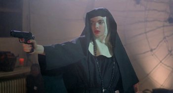 Movie still from “Ms .45” (1981), directed by Abel Ferrara – A woman dressed as a nun in a dark room; Medium shot, Low angle