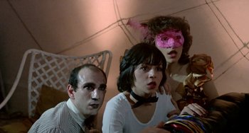 Movie still from “Ms .45” (1981), directed by Abel Ferrara – A group of young people wearing masks and posing for a picture; Medium shot, Low angle