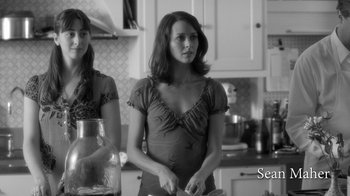 Movie still from “Much Ado About Nothing” (2012), directed by Joss Whedon – Two women standing in a kitchen preparing a meal; Medium shot, Over the shoulder angle
