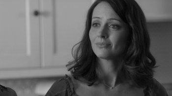 Movie still from “Much Ado About Nothing” (2012), directed by Joss Whedon – Black and white photograph of a woman looking at the camera; Close Up shot, Over the shoulder angle