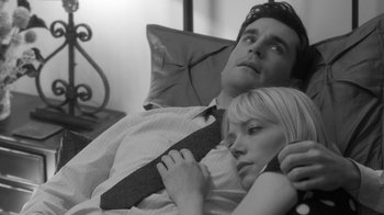 Movie still from “Much Ado About Nothing” (2012), directed by Joss Whedon – A man and a woman laying in a bed; Close Up shot, Low angle