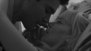 Movie still from “Much Ado About Nothing” (2012), directed by Joss Whedon – A man and a woman kissing each other; Extreme Close Up shot, Low angle
