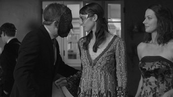 Movie still from “Much Ado About Nothing” (2012), directed by Joss Whedon – A man and a woman dressed up in costume; Medium shot, Over the shoulder angle